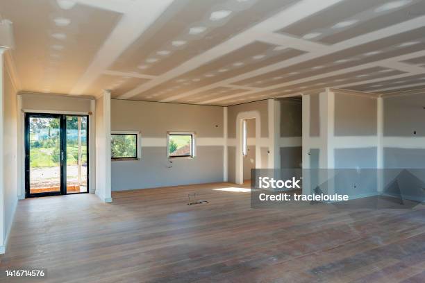 Residential House Being Built Stock Photo - Download Image Now - Drywall, Renovation, Construction Site