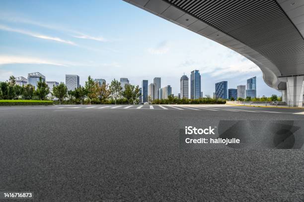 Empty Asphalt Road With City Skyline Background In China Stock Photo - Download Image Now