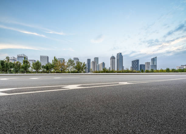 istock empty asphalt road with city skyline background in china 1416716900