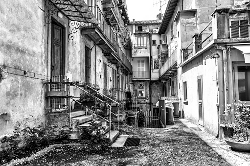 Rustic black and white image of an alley way in old town of Lake Como, Italy