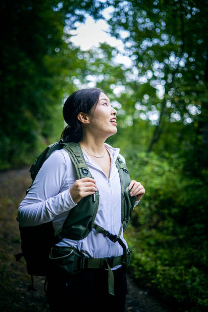 istock Woman Hiking in Forest Road 1416741650