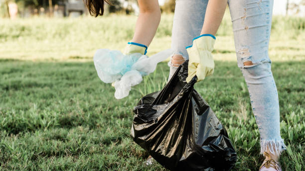 istock Woman collecting garbage from the environment 1416767174