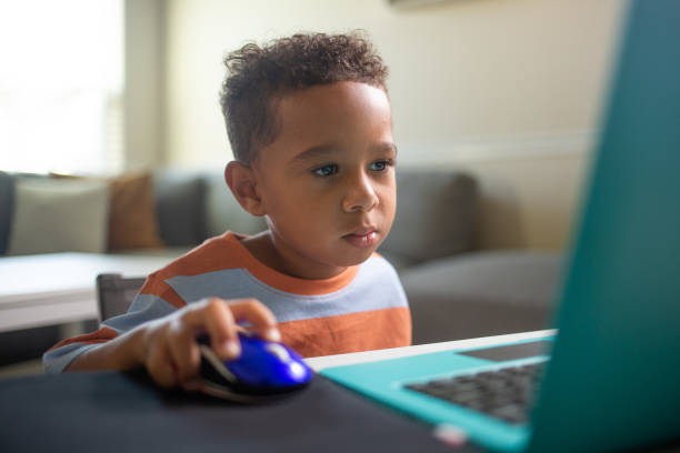 istock Close up Mixed 3 year Old Boy learning on the Laptop Computer 1416775568