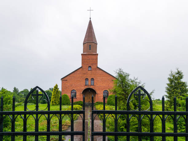 istock Red brick catholic church in Kalnciems, Latvia. 1416782892