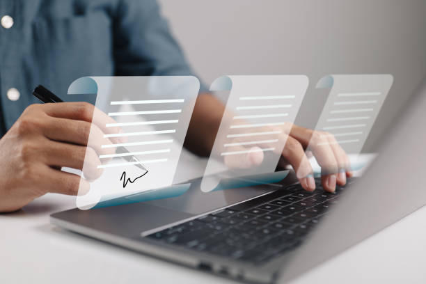 istock Agreement. Contracts were signed. Businessman using laptop with E-document icons, paperless office concept. 1416783096