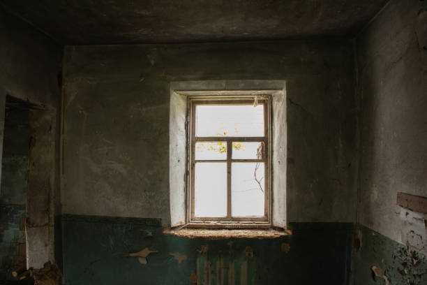 istock old abandoned one-story building dark without windows and doors, destroyed building 1416785701