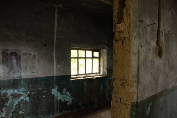 istock old abandoned one-story building dark without windows and doors, destroyed building 1416785789