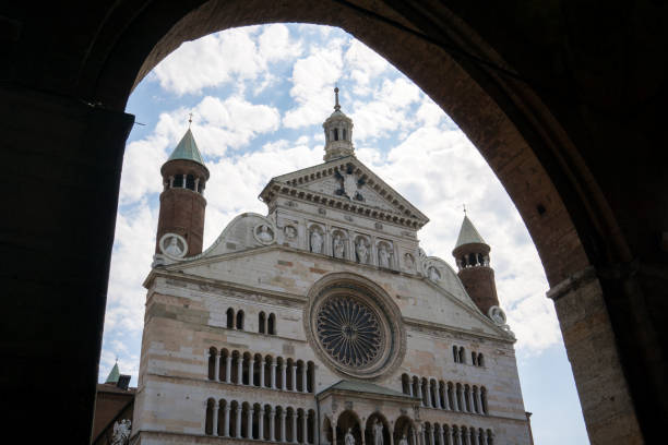 istock Dom of Cremona seen through an arch with blue cloudy sky 1416790736