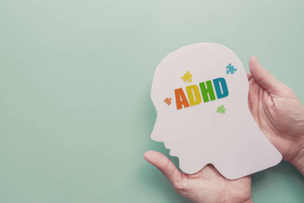 Hands holding brain with ADHD, Attention deficit hyperactivity disorder, mental disorder concept
