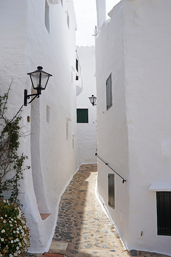 White houses form a small labyrinth of narrow, cobbled corridors- Menorca, Spain