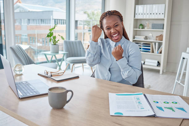 istock Cheering, celebrating and successful business analyst excited after analyzing laptop data, paperwork chart and profit report. Portrait of smiling, happy and winning woman with company growth mindset 1416809484