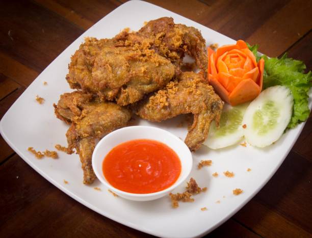 istock Galangal spiced fried chicken with chili sauce 1416811273