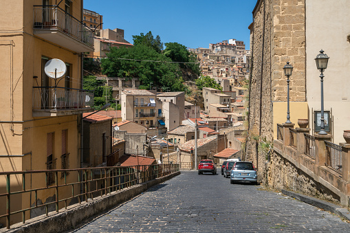 Enna, Italy - July 8, 2022: A view of a narrow street on a sunny summer day.