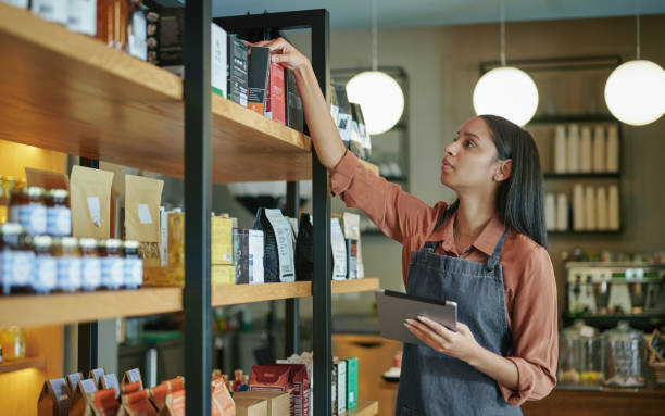 istock Deli owner using a tablet to check stock in her store 1416832333