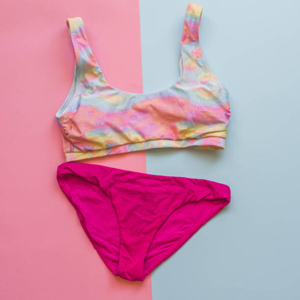 istock A set of multicolored rainbow swimsuit on a bright background. 1416832898