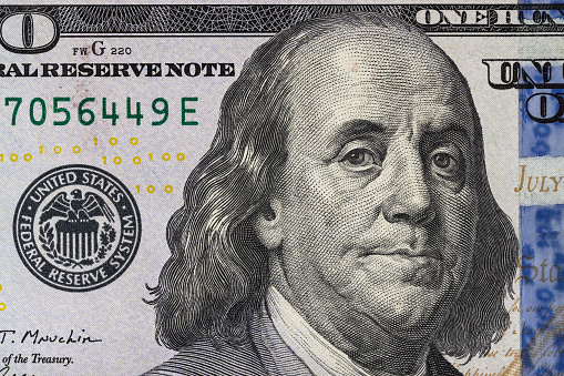 Close-Up View Of Benjamin Franklin On One Hundred Dollar Bill