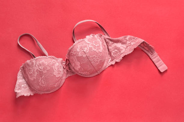 Lacy bra on red background stock photo
