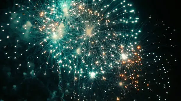 Photo of Green Firework celebrate anniversary happy new year 2023, 4th of july holiday festival. Green firework in night time celebrate national holiday. Countdown to new year 2023 festival party time event