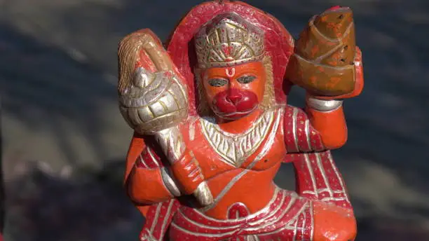 Photo of red soil made sculpture of lord hanuman