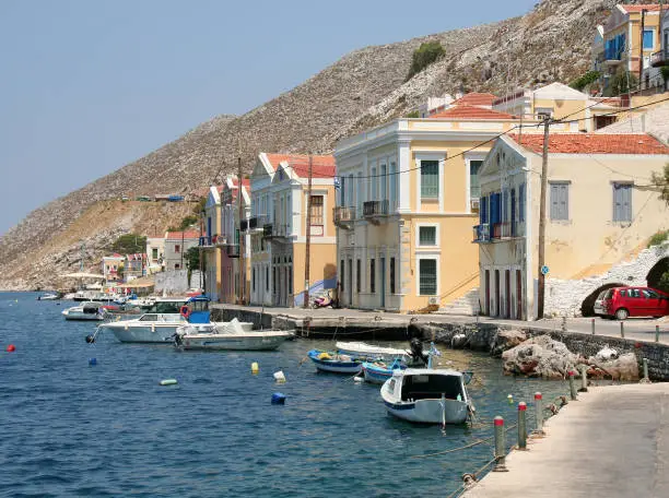 Typical Symi Houses and Boats by the Sea	in Symi Island, Greece