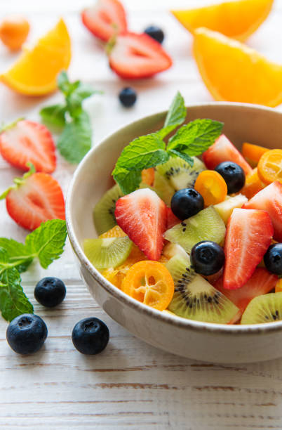 istock Healthy fresh fruit salad in a bowl 1416857172