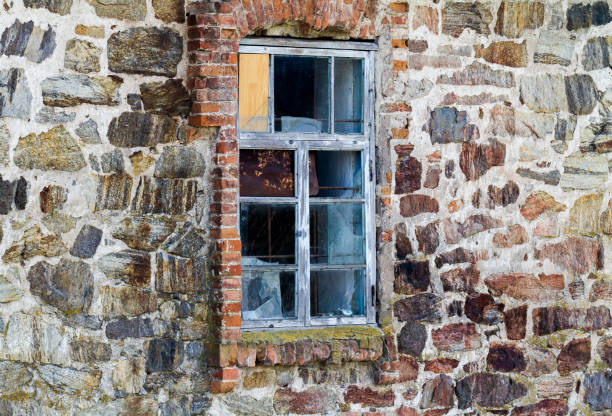 Old ruined window in a stone wall