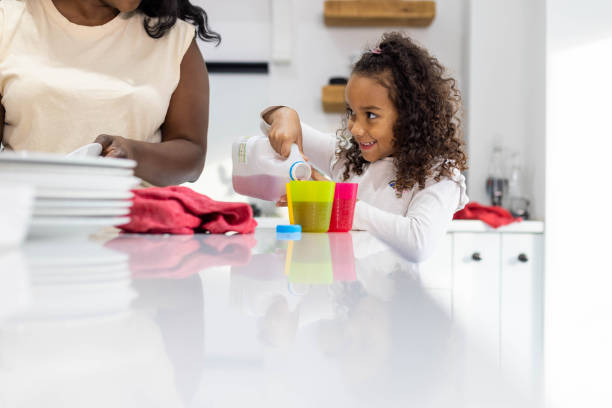 istock A Young Girl Helping her Mum 1416869291