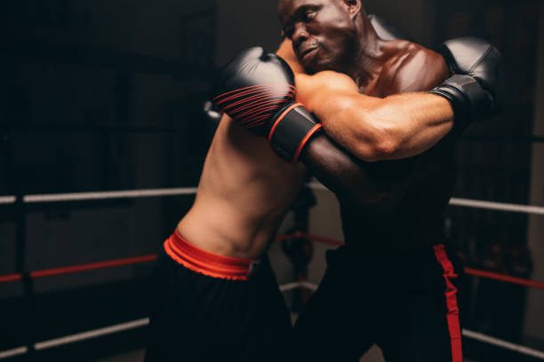 istock Male fighters fighting in a boxing ring 1416872785