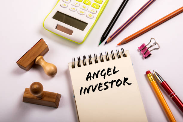 istock Angel investor. Stationery on a white office table 1416880323