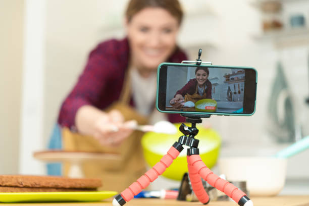 istock Smartphone recording a young woman while making a cake 1416884048