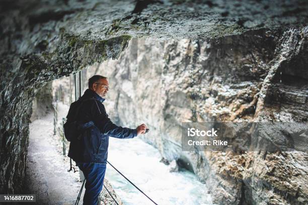 Attractive Man Sightseeing Gorge And Taking Photos In Bavaria Stock Photo - Download Image Now