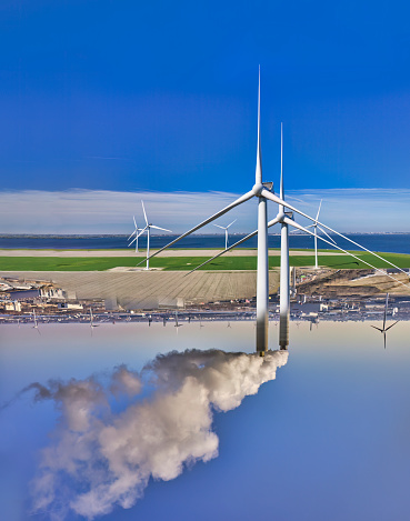 wind turbines in a field on a background of beautiful sky with clouds, bottom view