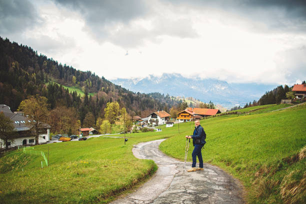 Attractive man hiking in the Bavarian Alps in spring.