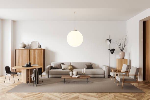 istock Light relax room interior with eating table and couch with armchair, drawer 1416895033