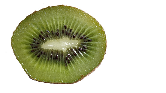 Kiwis flat lay on a marble background. Group of sliced and whole kiwi fruits viewed from above. Top view