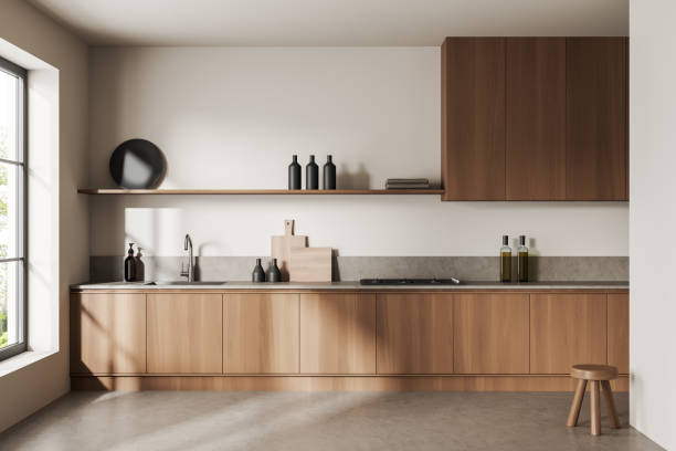 istock Light kitchen interior with shelves and appliances, kitchenware and window 1416901915