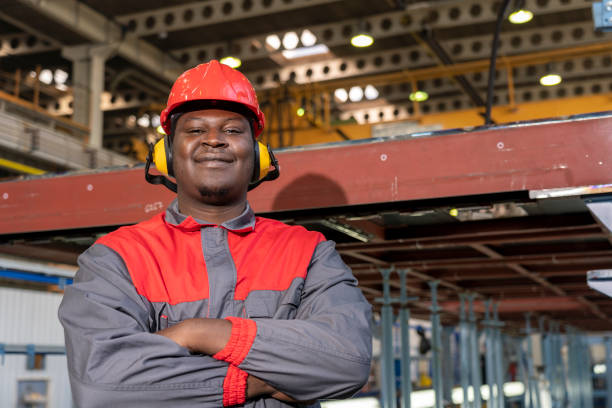 istock Happy African American Worker In Personal Protective Equipment Looking At Camera 1416911171