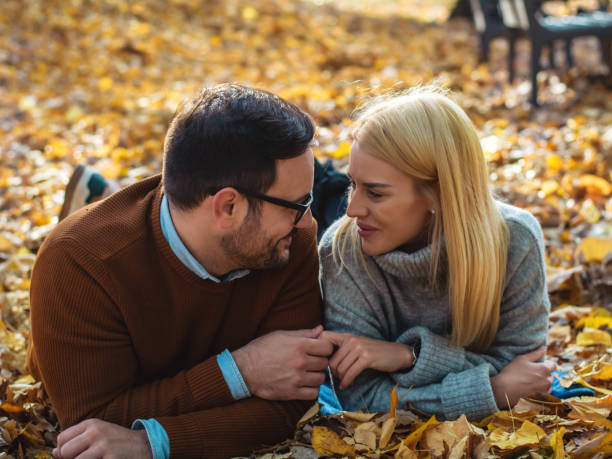 istock Romantic couple in autumn park 1416912201