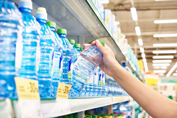 istock Drinking water in hand at shop 1416912220