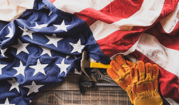 istock Happy Labor day concept. American flag with different construction tools on dark wooden background. 1416912984