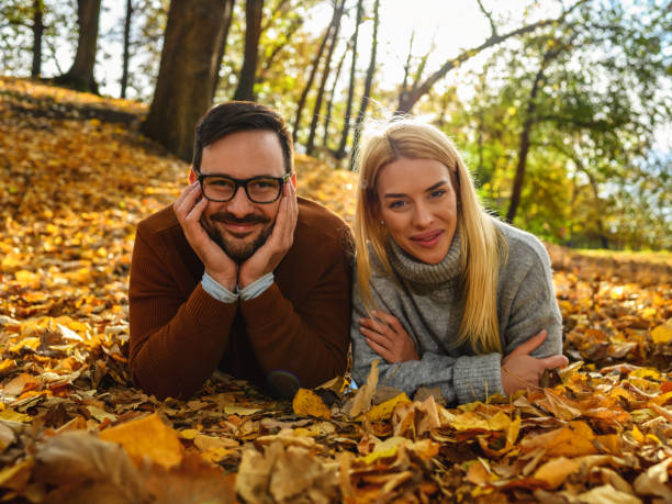 istock Romantic couple in autumn park 1416913627