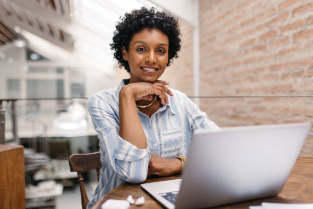 istock Confident small business owner smiling at the camera in a warehouse 1416913671
