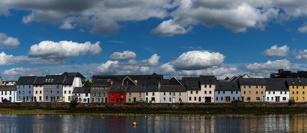 Galway, Ireland - 28 July, 2022: view of the River Corrib and the Long Walk Street with its colorful houses in downtwon Galway