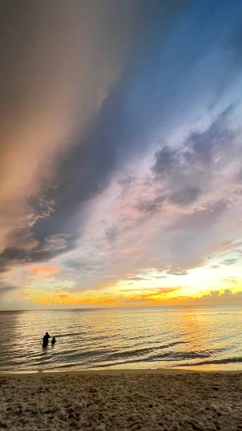 istock RELAXING ON THE BEACH AFTER SUNSET 1416915618