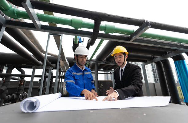 istock manager visit engineer working on the rooftop near pipe rack to inspection the progress 1416916413