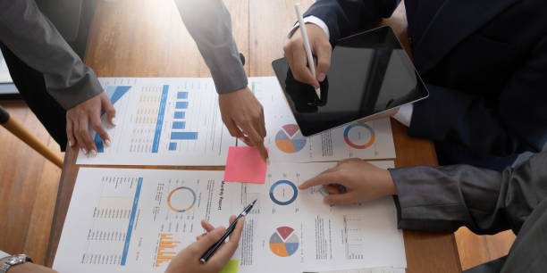 istock Teamwork with business people analysis cost graph on desk at meeting room. 1416923665
