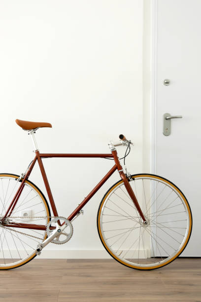 istock Brown urban bicycle at apartment home, vertical 1416925433