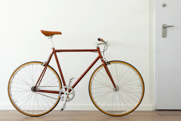 Brown hipster urban bicycle at apartment home. stock photo