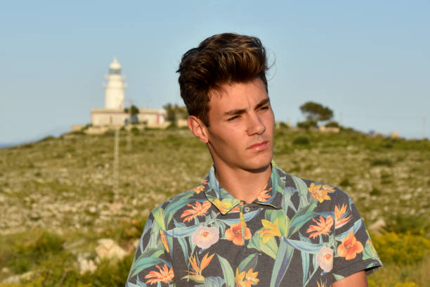 portrait of caucasian model on the mediterranean coast near a lighthouse