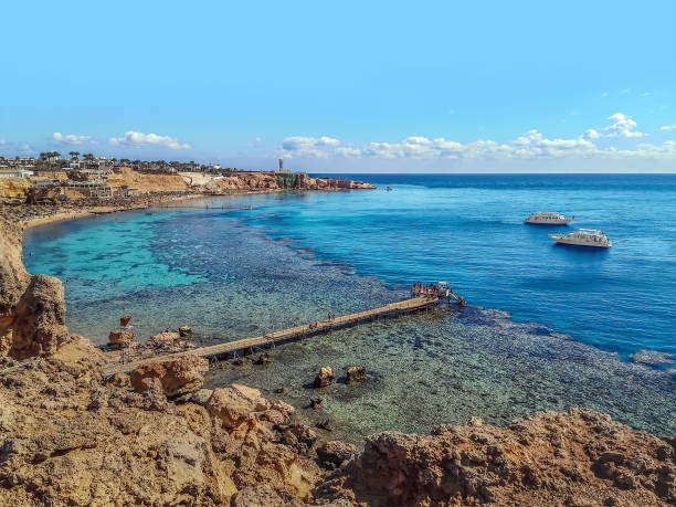 Wooden pier on the beach with a coral reef in Sharm El Sheikh, Egypt stock photo